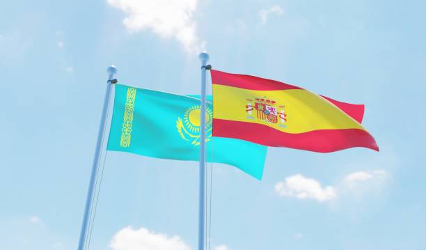 istock Spain and Kazakhstan, two flags waving against blue sky 1126924216