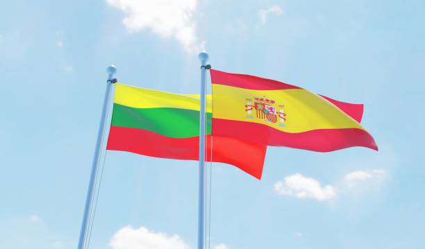 istock Spain and Lithuania, two flags waving against blue sky 1126924263