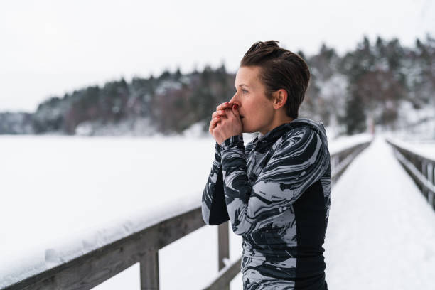 istock A woman is exercising out in the snow 1126925334