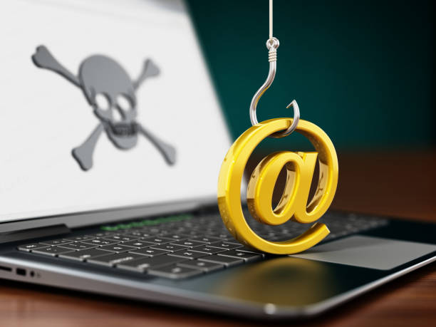 tentativo di phishing sul computer portatile. gancio per pesci che cerca di rubare il cartello "at" - fishing worm foto e immagini stock