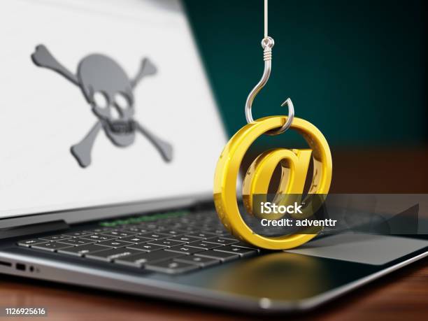 Phishing Attempt On Laptop Computer Fish Hook Trying To Steal At Sign Stock Photo - Download Image Now