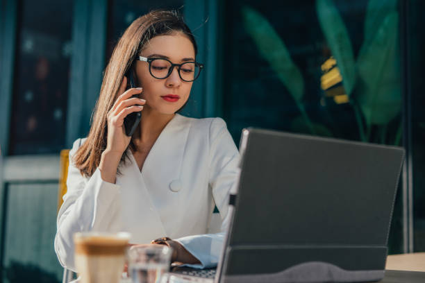 Elegant businesswoman using mobile phone