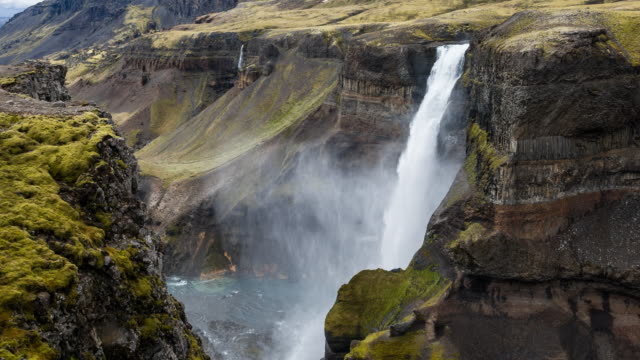 Haifoss waterfall dropping down into canyon in Iceland
