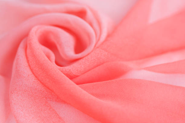 istock Pink red silk textile industry and fabric background 1126927797