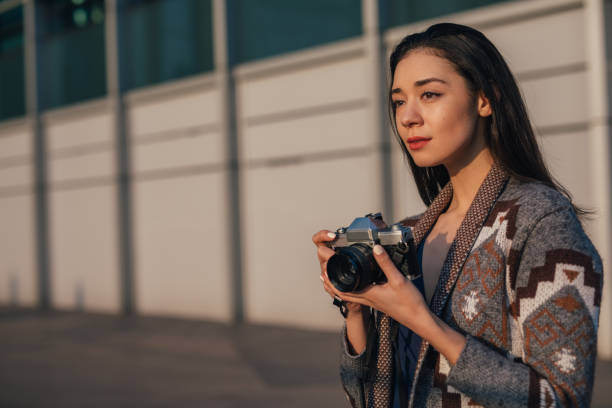 istock Beautiful female photographer 1126927959