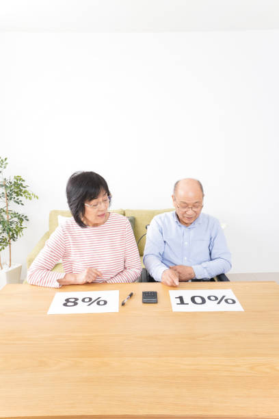 istock Senior couple talking about consumption tax increase 1126928944