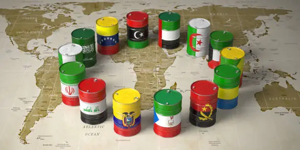 Photo of OPEC concept. Oil barrels in color of flags of countries memebers of OPEC on world political map background.