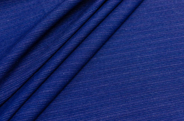istock Cotton fabric, blue and white striped jeans 1126930787