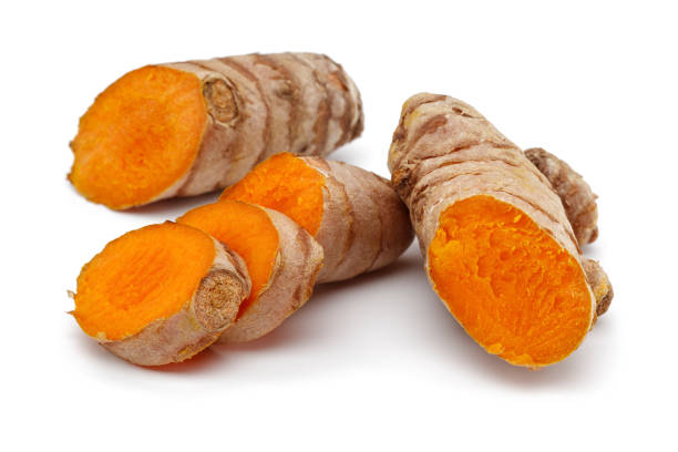 istock Fresh turmeric and slices on white background 1126931956