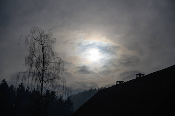 Gloomy gray sky with a few sunbeams