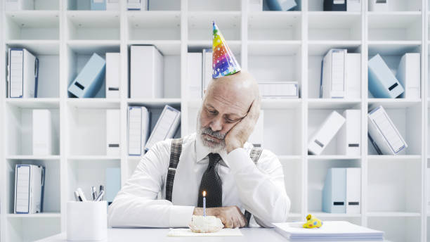 istock Senior businessman having a sad lonely birthday 1126932473