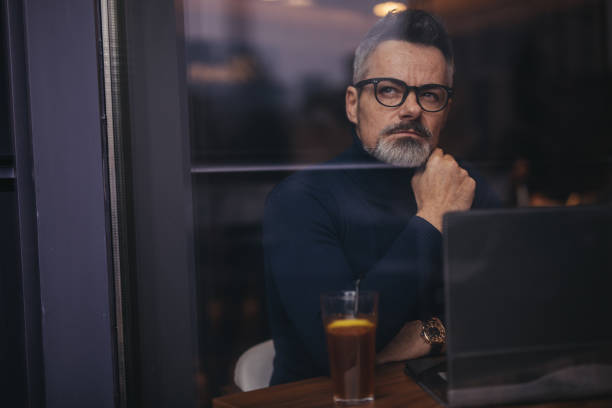 istock Mature man sitting in the coffee shop 1126932685