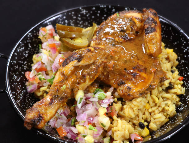 istock spice roasted whole baby chicken with flavored rice in a serving dish 1126933895