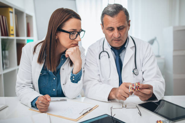 istock Doctor holding pills in hand 1126936812