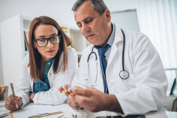 istock Doctor holding pills in hand 1126936934