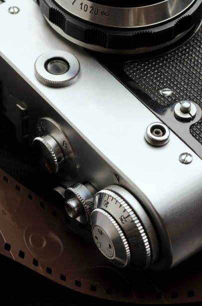 istock Vintage film camera on black background close-up 1126937871