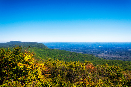 The fall foliage of the mountains and Connecticut and Massachusetts Landscape  on the appalachian Trail on top of Bear Mountain in Salisbury Connecticut.