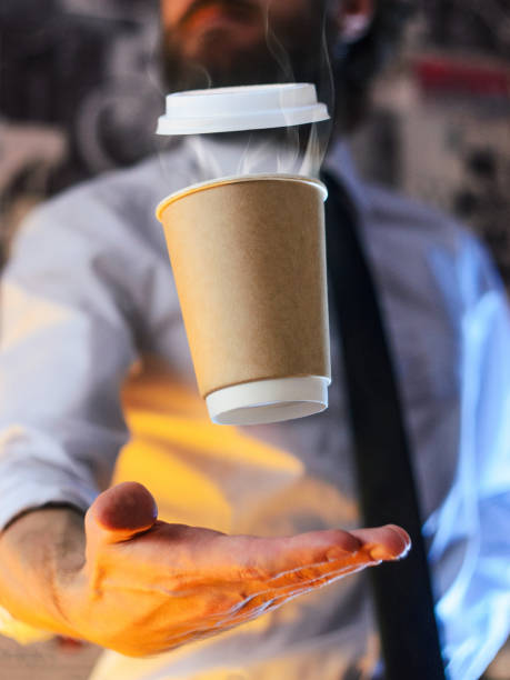 istock Barista and levitating cup of hot coffee 1126938228