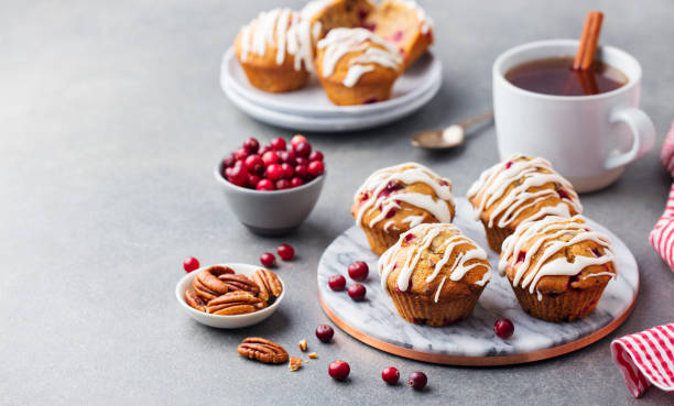istock Muffins, cakes with cranberry and pecan nuts. Top view. Copy space. 1126940722