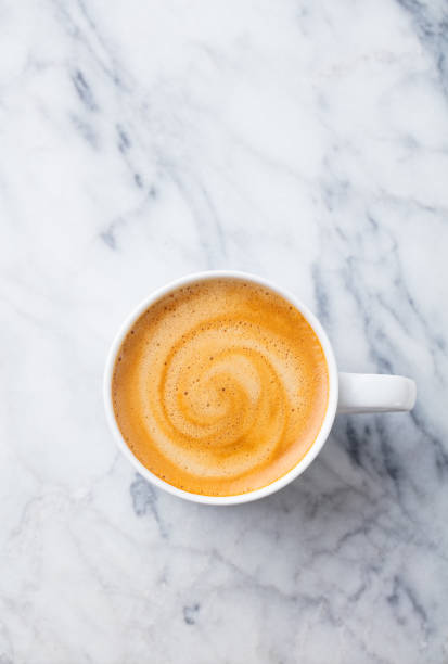 istock Coffee, espresso in white cup of marble table background. Top view. Copy space. 1126941015