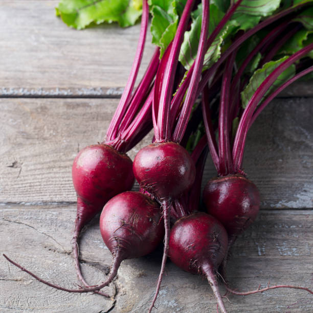 istock Fresh organic beet, beetroot on grey rustic wooden background. Top view. 1126942501