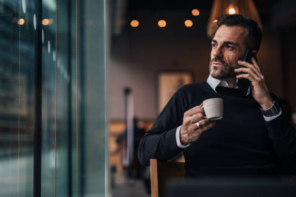 istock Man sitting in the caffee shop and drinking coffee 1126943364