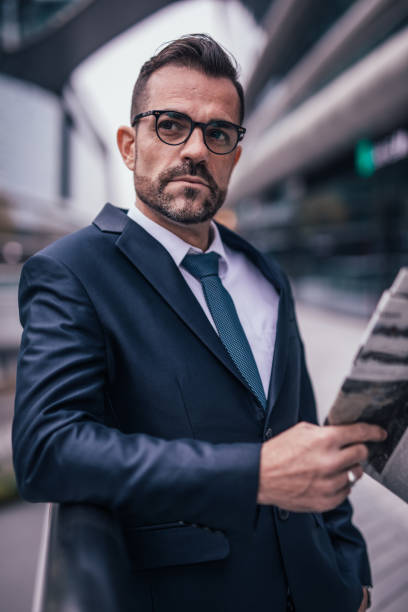istock Businessman reading newspaper 1126944017