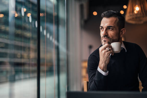istock Man drinking coffee in coffee shop 1126944390