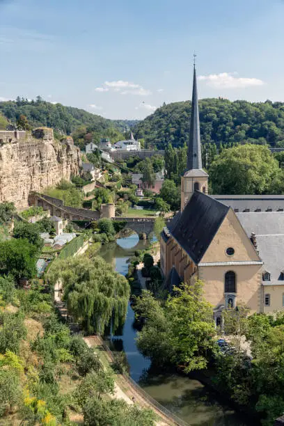 Luxembourg city, the capital of Grand Duchy of Luxembourg, aerial view at old medieval casemates and grund with neumunster abbey
