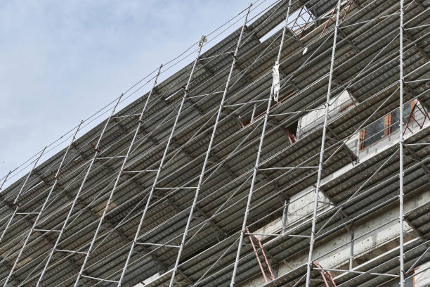 istock new building under construction, scaffolding and concrete 1126947063