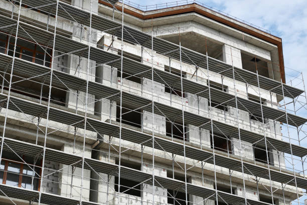 istock new building under construction, scaffolding and concrete 1126947235