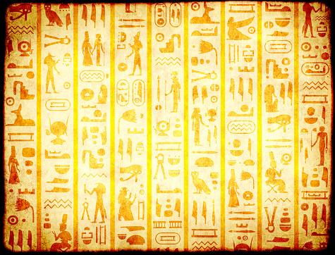 Grunge background with old paper texture and ancient egyptian hieroglyphs and symbols