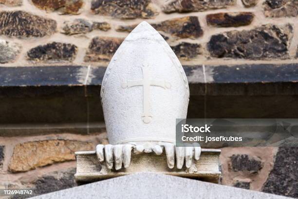 Three Symbols Of Bishop Miter With Cross Gloves And Book In Front Of The Cathedral Of St Peter And Paul Brno South Moravia Czech Republic Stock Photo - Download Image Now