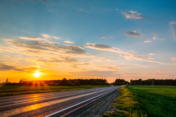 istock Orange sunset over the forest and the highway. Nobody 1126951426