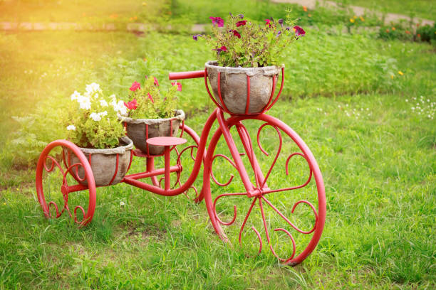 istock Baskets flower beds in the form of a bicycle 1126951492