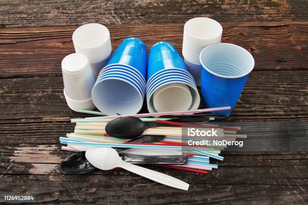 Disposable Plastic Straws Cups Cutlery Stock Photo - Download Image Now - Plastic, Disposable, Drinking Straw
