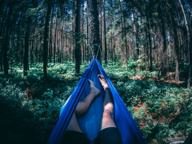 the resting in a hammock in the woods
