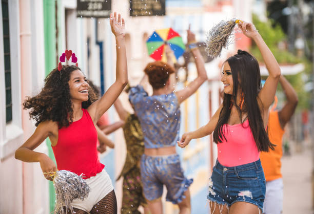 istock Young people dancing at street carnival 1126957842