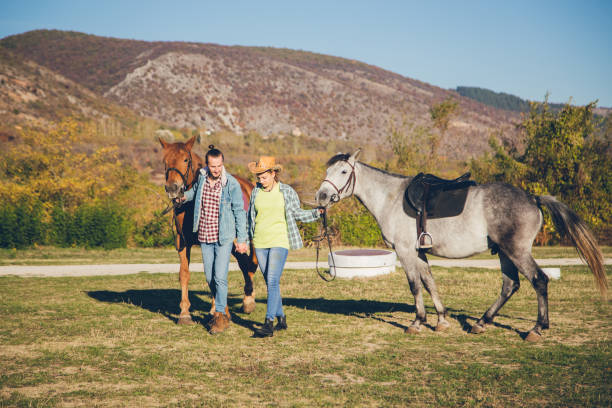 istock Cowboy couple with horses 1126961993