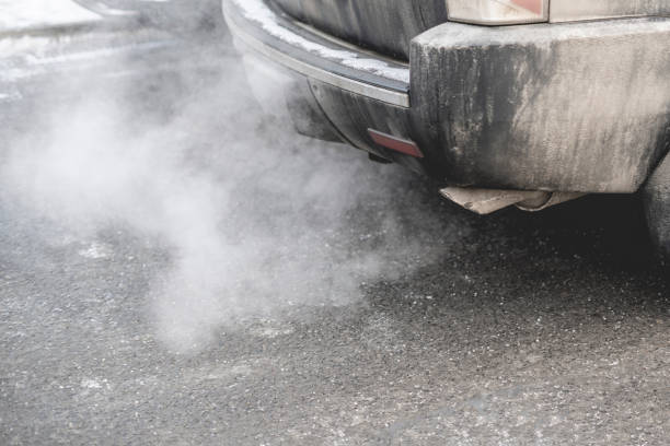 istock car pipe exhaust release smoke. air pollution concept b 1126963190