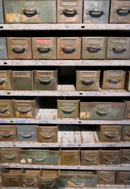istock Old rosty shelf with many drawers and boxes in a disused workshop 1126965266