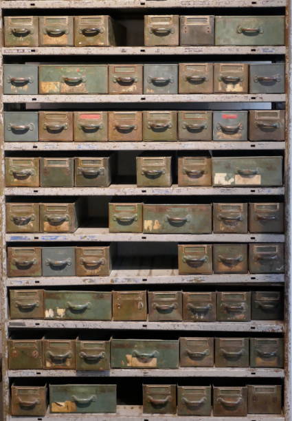 istock Old rosty shelf with many drawers and boxes in a disused workshop 1126965269