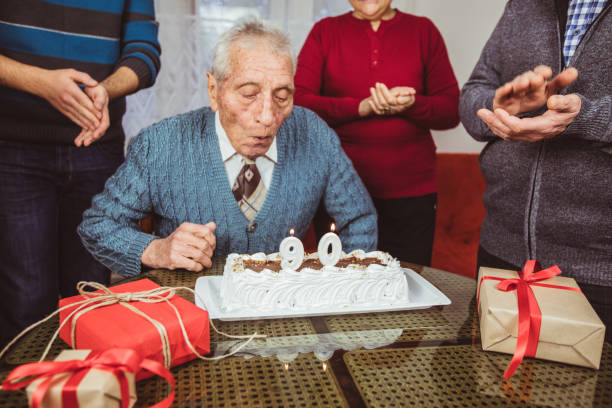 istock Senior man celebrates birthday 1126968774