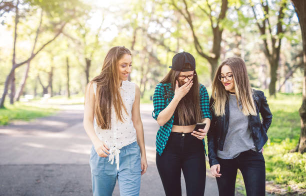 istock Girls taking a walk in a park 1126969382