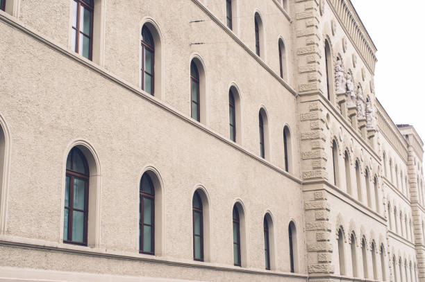 istock Two windows of a brick building with sky blue windows 1126972472