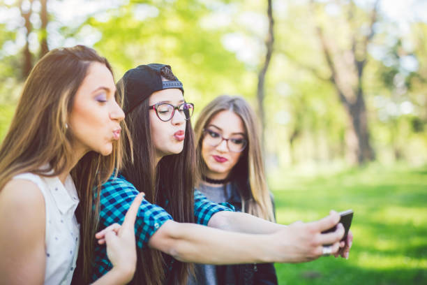 istock Hipster girls taking selfies 1126972538
