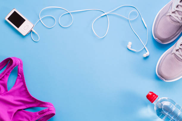 istock Fitness gym equipment on blue background 1126974568