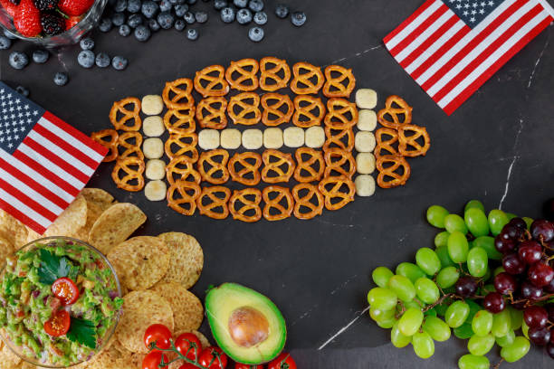 istock Table full tasty snacks for watching super football game 1126975476