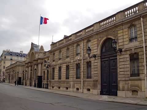 Paris, France, 2019 january 29 : entrance of the Elysee Palace, rue du Faubourg Saint Honoré (8th arrondissement),  official residence of the President of France, with french flag above the main gate