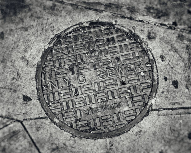 New York City Sewer Cover NYC Manhole Cover sewer lid stock pictures, royalty-free photos & images